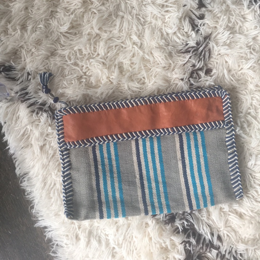Striped clutch with leather detail